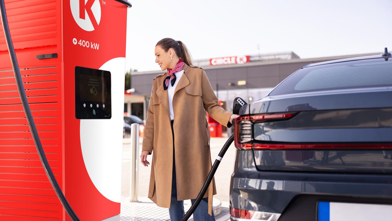 Woman charging her car at Circle K