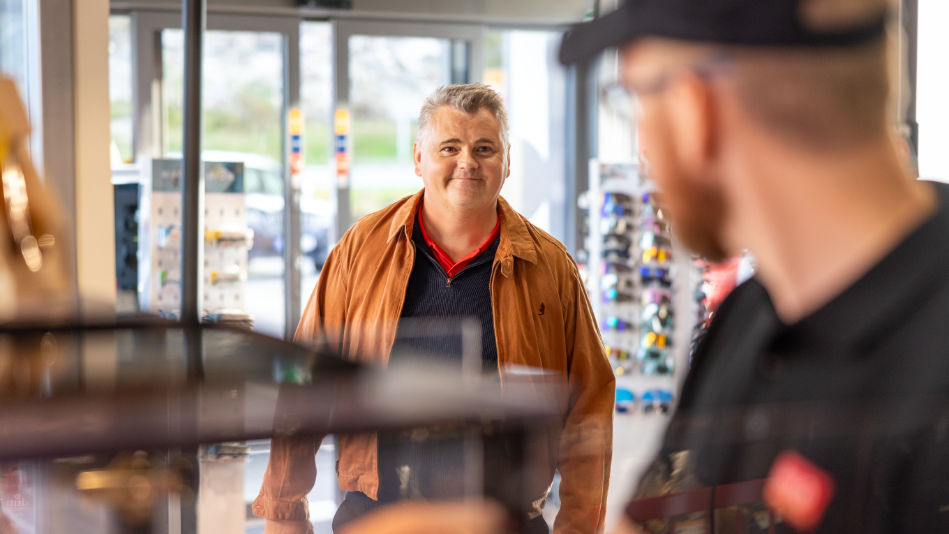 Man walking into Circle K store
